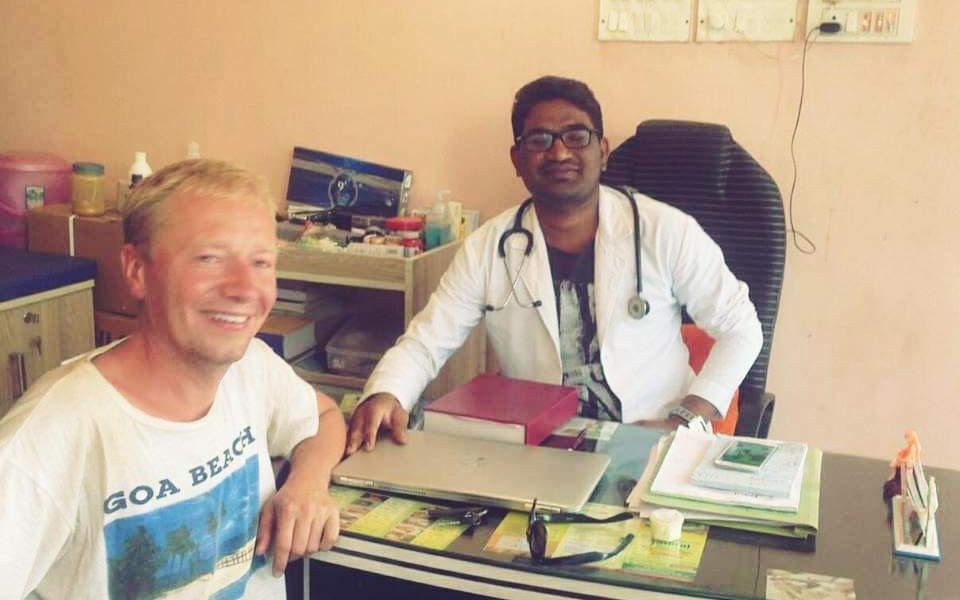 A doctor speaking with a patient during a clinic consultation