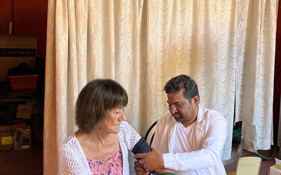A healthcare professional checking a patient's blood pressure